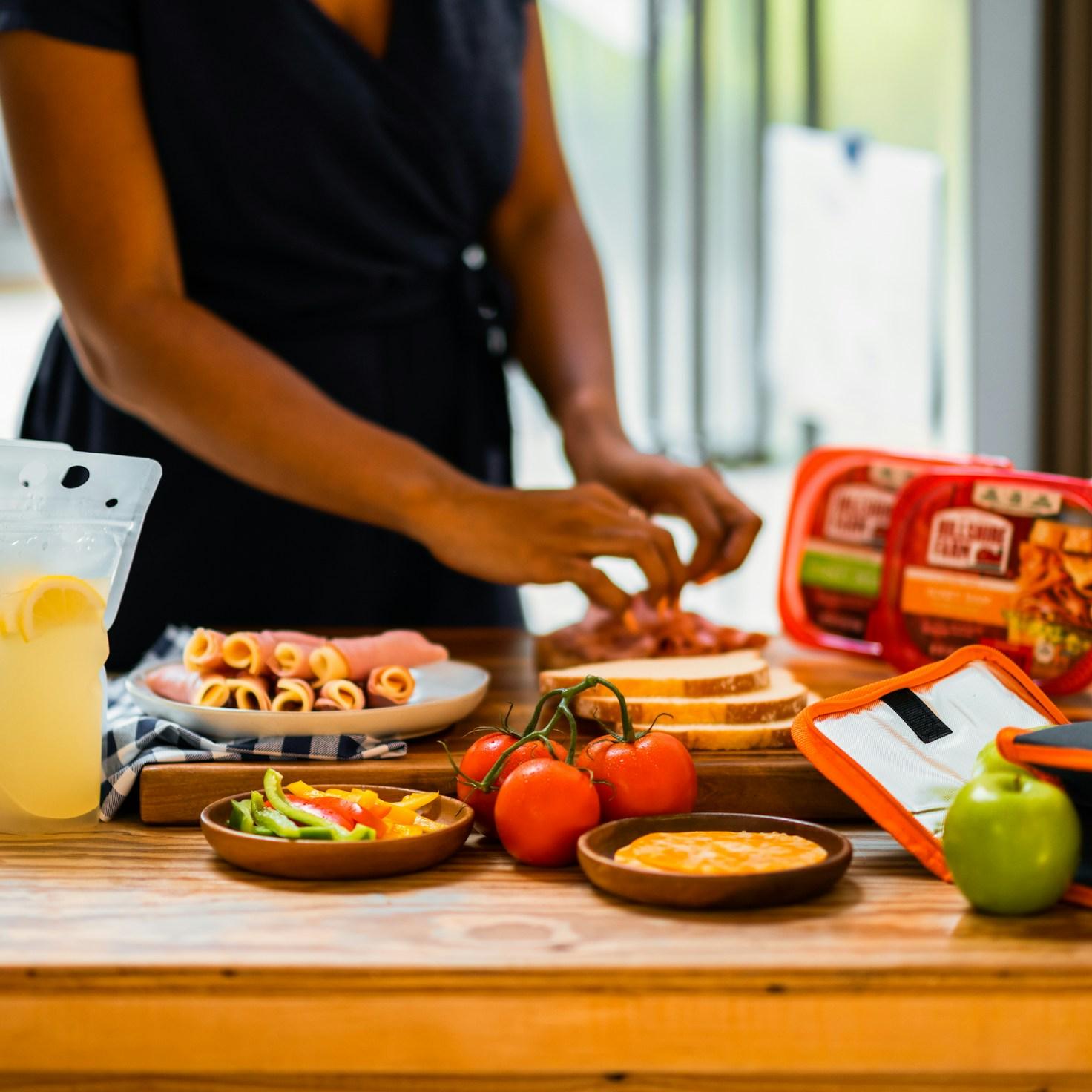People collaborating in a contemporary kitchen, exchanging recipes and culinary techniques